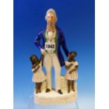 A 19th C. STAFFORDSHIRE POTTERY FIGURE NAMED FOR JOHN BROWN STANDING WITH TWO BLACK CHILDREN. H