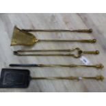 A SET OF THREE 19th C. BRASS FIRE IRONS TOGETHER WITH AN EARLIER BRASS AND IRON SHOVEL AND