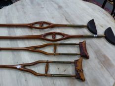 FOUR PAIRS OF ANTIQUE WOODEN CRUTCHES