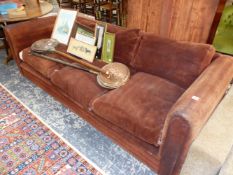 A BROWN SUEDE UPHOLSTERED THREE SEAT SETTEE. W 233cms.