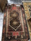 A BELOUCH PRAYER RUG. 145 x 83cms. TOGETHER WITH A MACHINE MADE RUG OF PERSIAN HUNTING DESIGN. 190 x