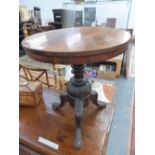 A 19th C. ROSEWOOD CIRCULAR TABLE ON FOLIAGE CARVED COLUMN AND TRIPOD. Dia. 50 x H 54cms.