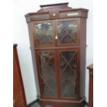 A 19th C. MAHOGANY CORNER CUPBOARD WITH SHELVES BEHIND TWO PAIRS OF GLAZED DOORS. W 110 x D 59 x H