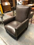 A LATE VICTORIAN PATENT ADJUSTABLE ARMCHAIR CLOSE NAILED UPHOLSTERED IN BROWN LEATHER, RECLINING