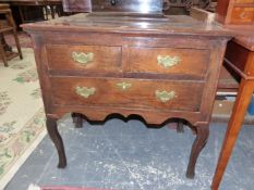 AN 18th C. AND LATER OAK LOWBOY WITH TWO SHORT AND A LONG DRAWER ABOVE THE SHAPED APRON AND CABRIOL