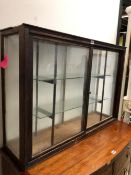A 20th C. GLAZED STAINED WOOD DISPLAY CABINET. W 101 x D 29 x H 71cms.