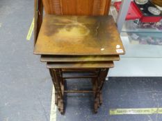 AN ANTIQUE NEST OF THREE HAND PAINTED OCCASIONAL TABLES.