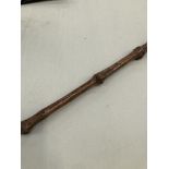A VINTAGE FOLK ART CARVED AND INSCRIBED WALKING STICK WITH A HEAD FORM, TERMINAL. L. 80cms