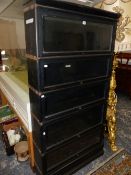 A PAIR OF GLOBE WERNICKE EBONISED FIVE TIER BOOKCASES, EACH. W 87 x D 25 x H 171cms.