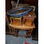 A NEST OF THREE OAK TABLES A BRASS TRIVET AND LOW OAK STOOL AND A PAPIER MACHE BOWL.