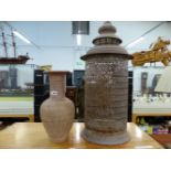 A PIERCED MOORISH STYLE LANTERN AND A POTTERY VASE.