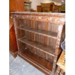 A FOLIATE CARVED OAK OPEN BOOKCASE WITH TWO ADJUSTABLE SHELVES. W 106 x D 31 x H 112cms.