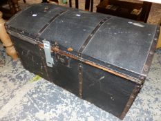 AN IRON BOUND BLACK CLAD TRUNK WITH ROUNDED LID. W 81.5cms.