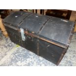 AN IRON BOUND BLACK CLAD TRUNK WITH ROUNDED LID. W 81.5cms.