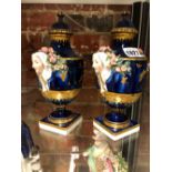 A PAIR OF GOLD ANCHOR MARK BLUE GROUND BALUSTER VASES AND COVERS, THE HANDLES MODELLED AS LADIES