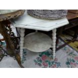 A CREAM PAINTED PINE TABLE, THE OCTAGONAL TOP ON THREE BOBBIN TURNED LEGS JOINED BY A CIRCULAR TIER.