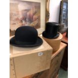 A LOCK & CO TOP HAT AND A WOODROW BOWLER HAT.