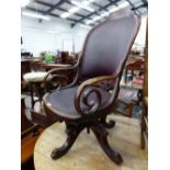 AN AMERICAN VICTORIAN OAK DESK CHAIR, THE HOOP BACK AND SEAT UPHOLSTERED IN RED LEATHERETTE AND