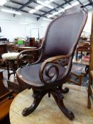 AN AMERICAN VICTORIAN OAK DESK CHAIR, THE HOOP BACK AND SEAT UPHOLSTERED IN RED LEATHERETTE AND