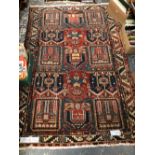 AN ANTIQUE PERSIAN BAKHTIARI RUG 204 x 140cms