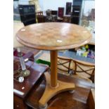 A VICTORIAN WALNUT CIRCULAR TABLE, THE TOP INLAID WITH A CHESS BOARD, THE OCTAGONAL COLUMN ON A