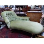 A VICTORIAN CHAISE LONGUE BUTTON BACKED IN PALE GREEN VELVET, WHITE CERAMIC CASTER FEET