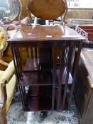 AN EARLY 20th CENTURY MAHOGANY ROTARY BOOKCASE, THE SQUARE TOP OVER TWO TIERS OF SHELVES. W 46.5 x D