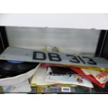 A SMALL COLLECTION OF RECORD SINGLES AND A PAIR OF LICENCE PLATES DB 313( NOT REGISTRATION)