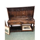 AN 18th C. OAK DRESSER BASE WITH A LATER FOUR PANEL BACK, THE BASE WITH TWO DRAWERS OVER A POT BOARD