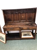 AN 18th C. OAK DRESSER BASE WITH A LATER FOUR PANEL BACK, THE BASE WITH TWO DRAWERS OVER A POT BOARD