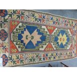 A TURKISH RUNNER RUG. 236 x 134cms. TOGETHER WITH A SMALL PERSIAN PATTERN MACHINE MADE RUG. (2)