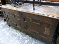 AN 18th C. OAK COFFER WITH A THREE PANELLED LID OVER TWO GEOMETRICALLY PANELLED FRONT. W 138 x D