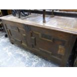 AN 18th C. OAK COFFER WITH A THREE PANELLED LID OVER TWO GEOMETRICALLY PANELLED FRONT. W 138 x D