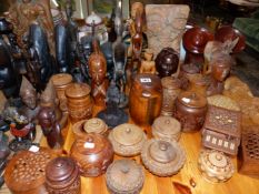 A QUANTITY OF AFRICAN AND OTHER CARVED FIGURES, BOXES ETC.