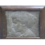 A FRAMED METAL RELIEF PROFILE OF A LADY DATED 1913 AND SIGNED M V M CARR?. 26 x