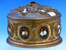 A 19th C. FRENCH ORMOLU TRINKET BOX OF OVAL SECTION AND INSET WITH BLACK GROUND PIETRA DURA OVALS OF