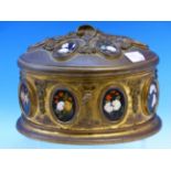A 19th C. FRENCH ORMOLU TRINKET BOX OF OVAL SECTION AND INSET WITH BLACK GROUND PIETRA DURA OVALS OF