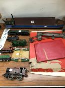 A HORNBY O GAGE CLOCK WORK TRAIN WITH SOME RAIL, AN ELECTRIC HORNBY DUBLO ELECTRIC LOCOMOTIVE,