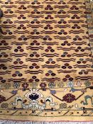 (F) A TURKISH CARPET OF UNUSUAL DESIGN 330 x 253cms.