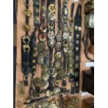 A COLLECTION OF HORSE BRASSES MAINLY PRESENTED ON LEATHER STRAPS