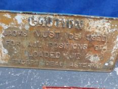 A CAST IRON RAILWAY SIGNED INSCRIBED CAUTION JACKS MUST BE USED FOR ALL POSITIONS OF LOADED JIB