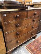 A LATE GEORGIAN OAK CHEST OF FIVE DRAWERS.