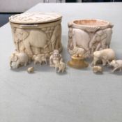 A GROUP OF EARLY 20th C. IVORY ELEPHANTS AND ELEPHANT CARVED BOXES.