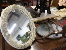 A WHITE PORCELAIN FRAMED MIRROR AND A MAHOGANY SWING MIRROR.