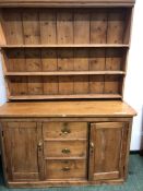 AN ANTIQUE PINE DRESSER W 159 X H 213 X D57cms.