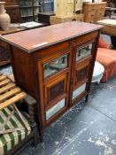 AN EDWARDIAN MAHOGANY TWO DOOR SIDE CABINET, A FOLDING CAMPAIGN BED, RECLINING ARM CHAIR AND A