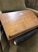 A VICTORIAN OAK BIBLE STAND AND BIBLE.