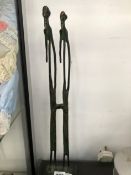 A PAIR OF ETHNIC BRONZE TALL FIGURES OF MEN BOTH WITH RIGHT HANDS ON THEIR CHINS. H 40cms.