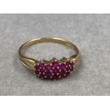 A HALLMARKED 9ct GOLD RUBY MULTI CLUSTER DRESS RING. FINGER SIZE T. WEIGHT 1.5grms.