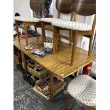 A MID CENTURY RETRO DINING TABLE AND FOUR CHAIRS.